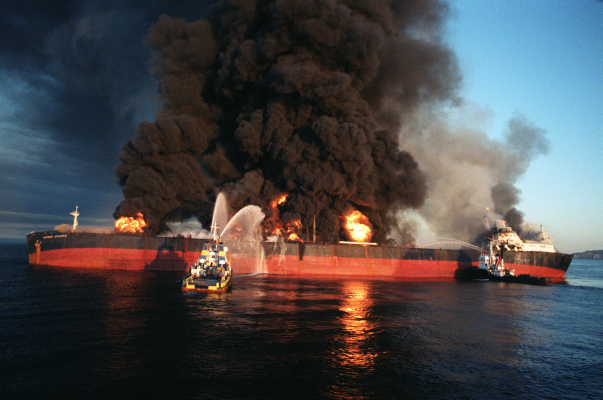 A Singaporean-flagged tanker ablaze in the Strait of Hormuz after an Iranian attack during the Iran-Iraq War, December 6, 1987.